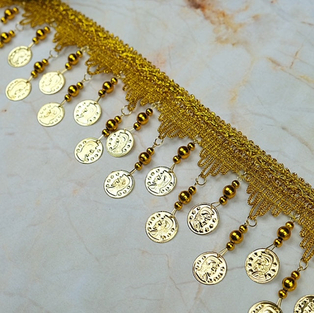 Dangling spartan coin and bell ring trim by yard
