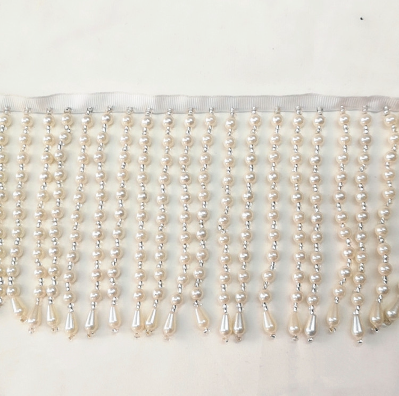 Dangling pearl trim by yard