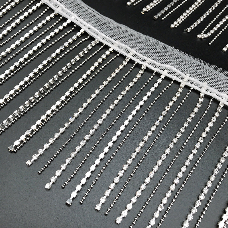 Dangling rhinestone trim stitched on mesh by yard