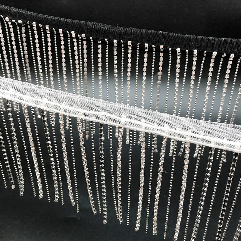 Dangling rhinestone trim stitched on mesh by yard