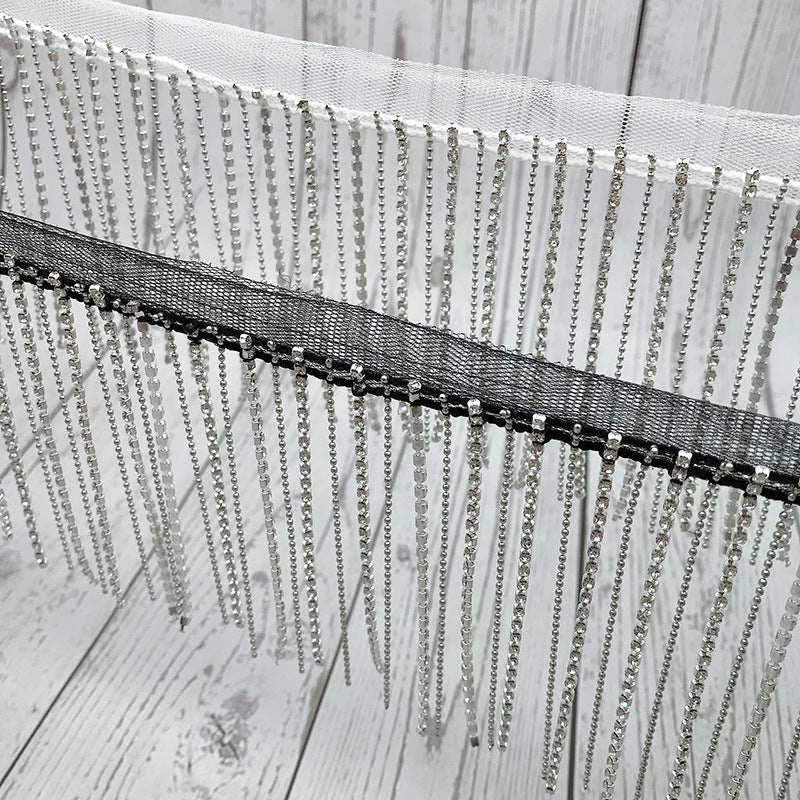 Dangling rhinestone trim stitched on mesh by yard